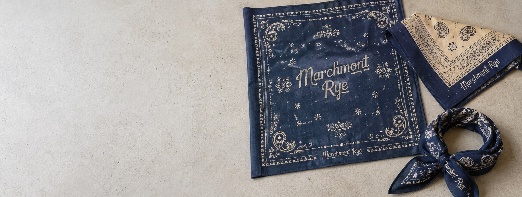 Custom printed bandanas with logo spread on a table